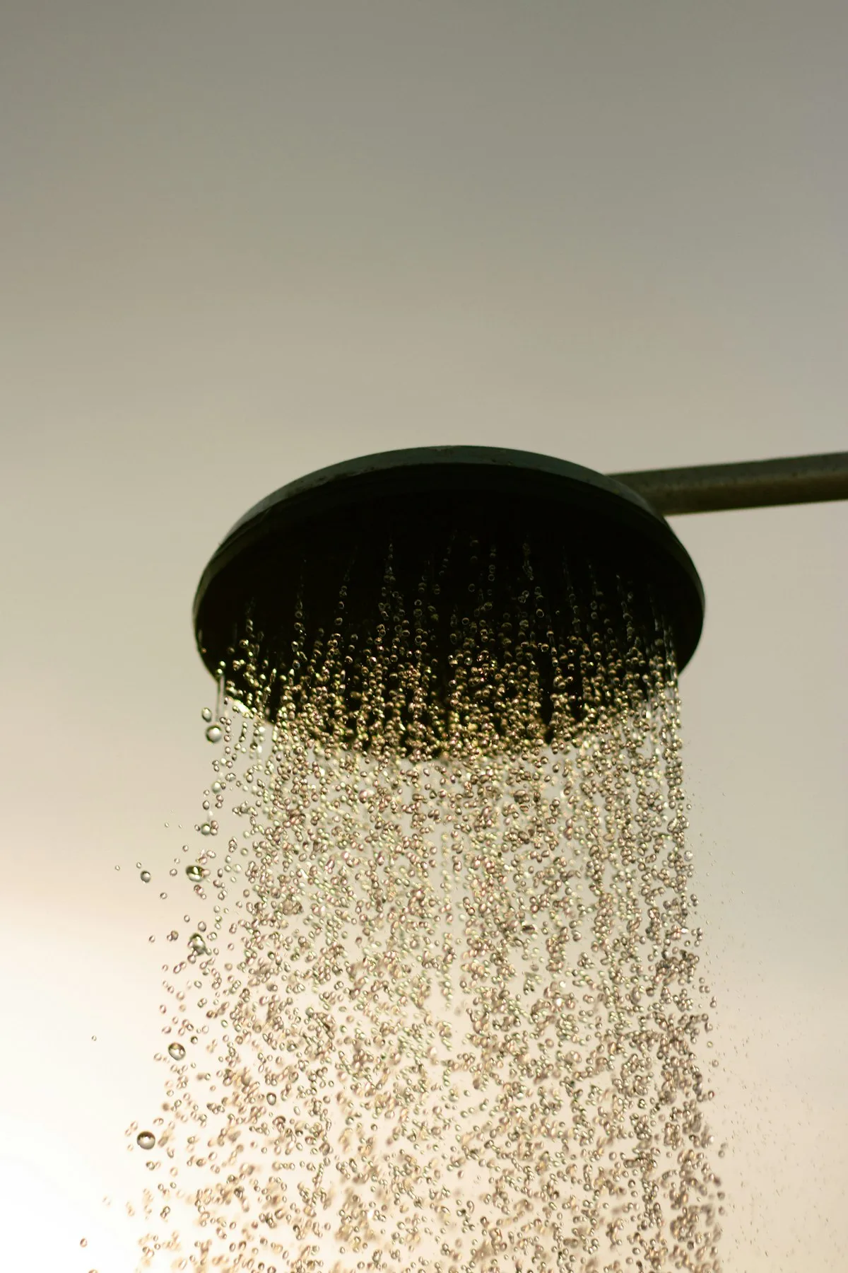 A showerhead with running water.