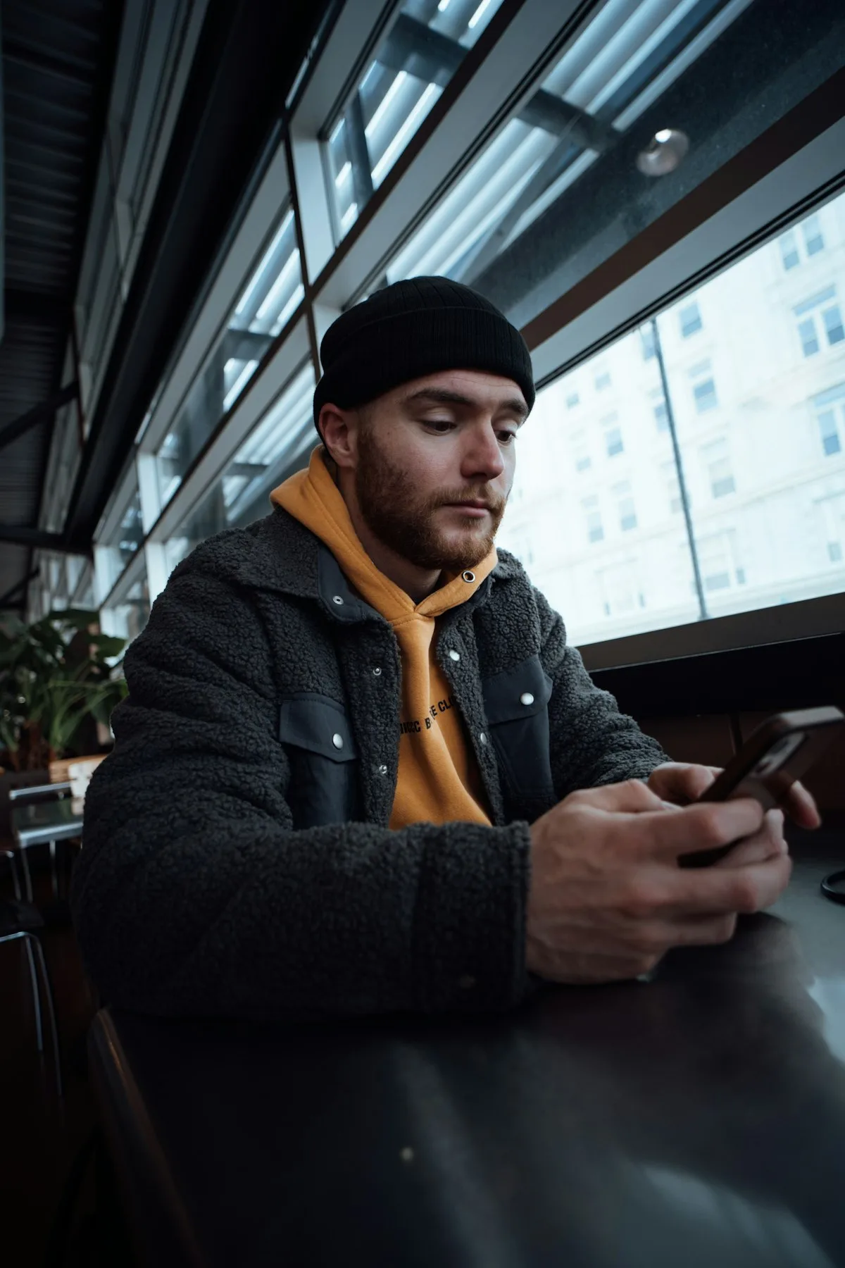 Someone looking suspiciously at their phone.